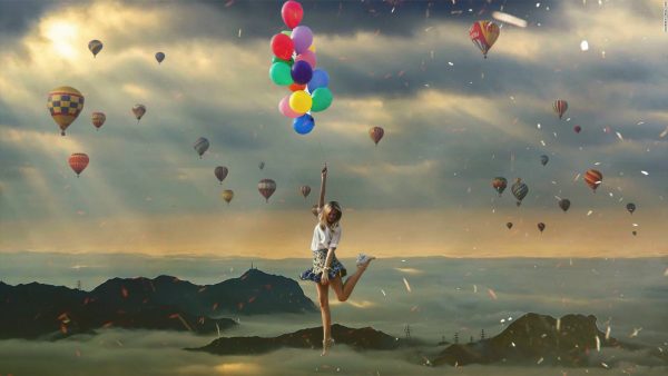 Flying girl with balloons Photomanipulation